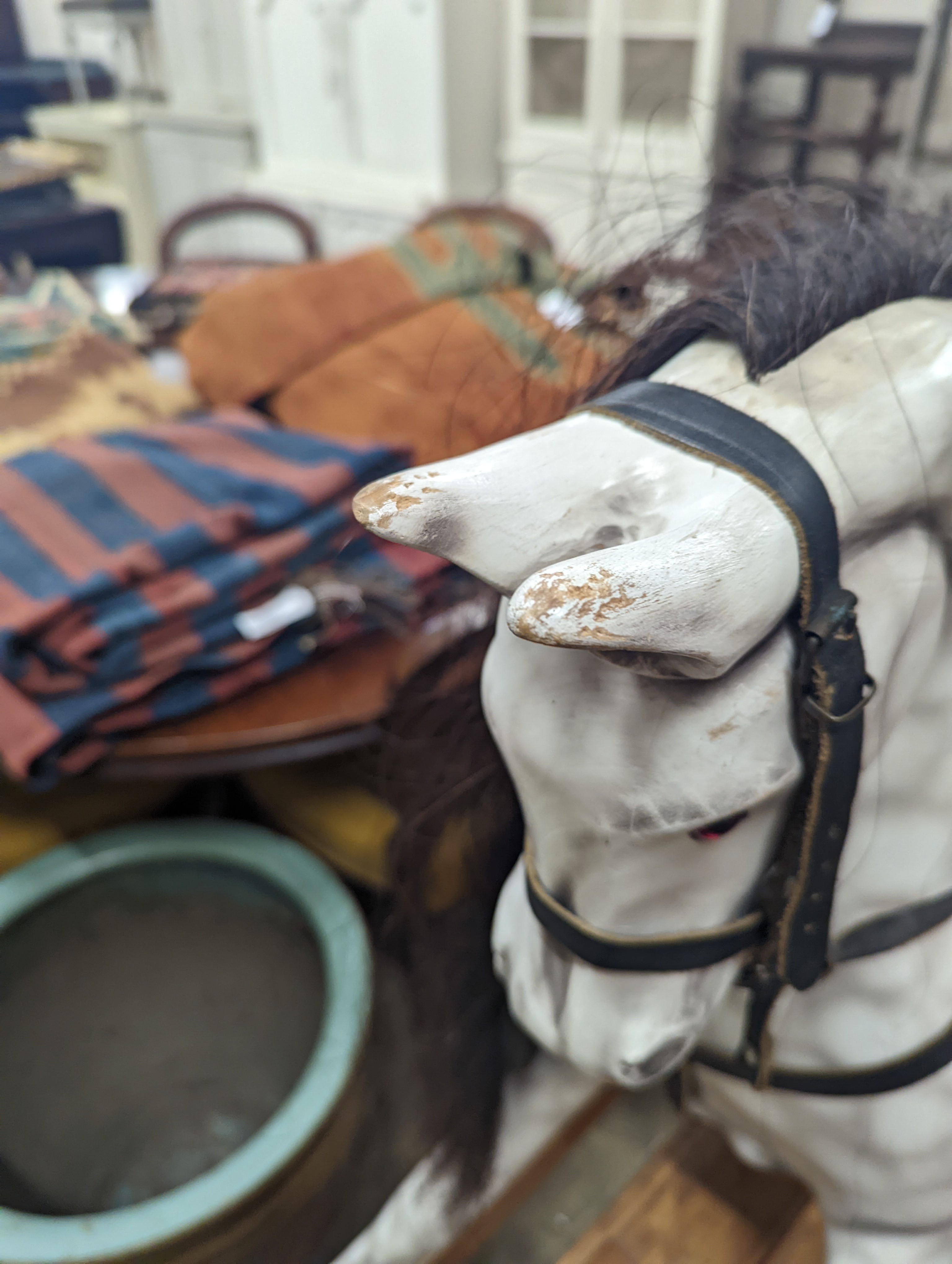 A Victorian style dapple grey rocking horse on pine stand, length 152cm, height 126cm